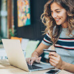 Young woman shopping on-line - insurance rating engine